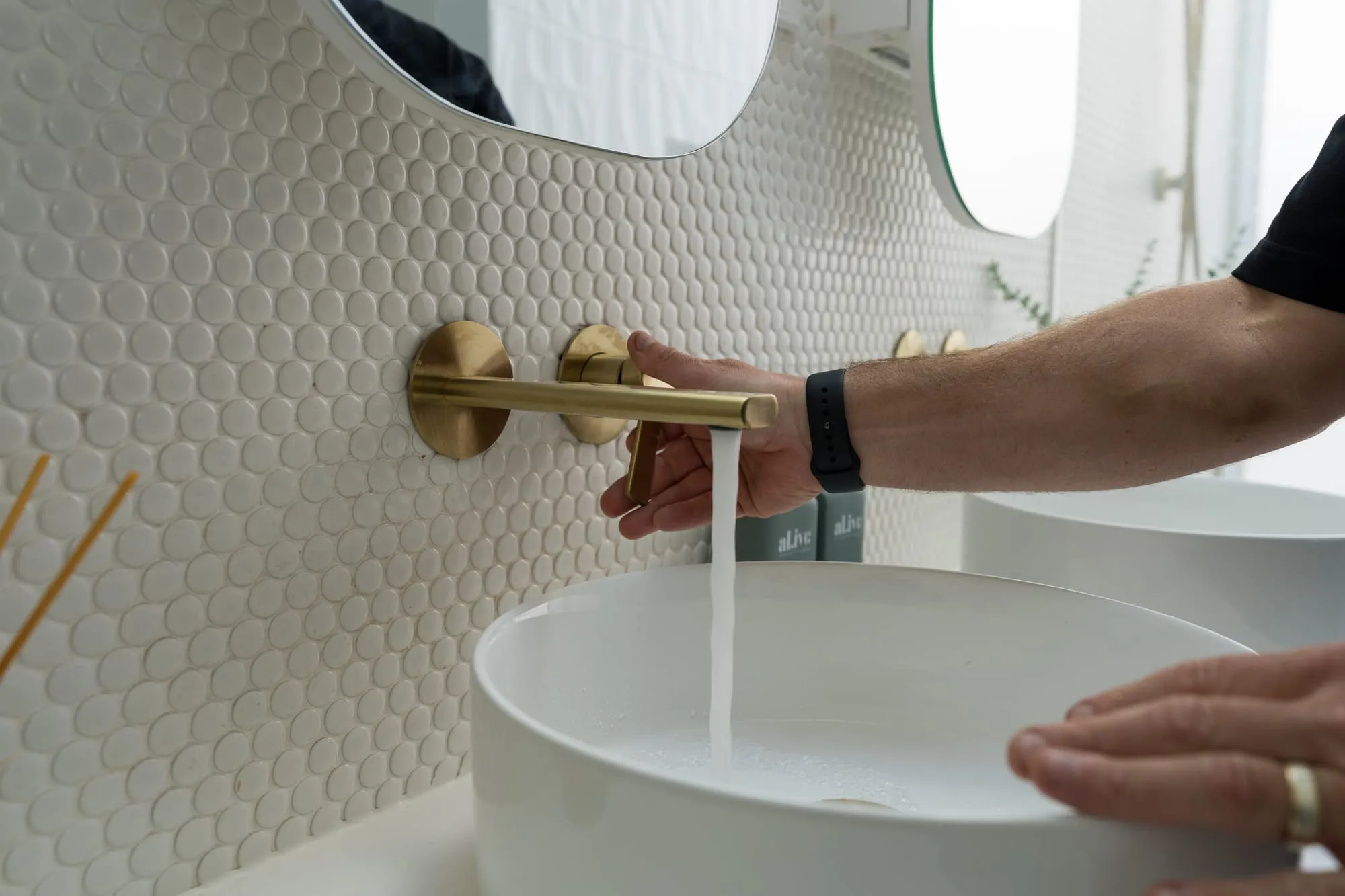 Wall-mounted basin mixer being tested