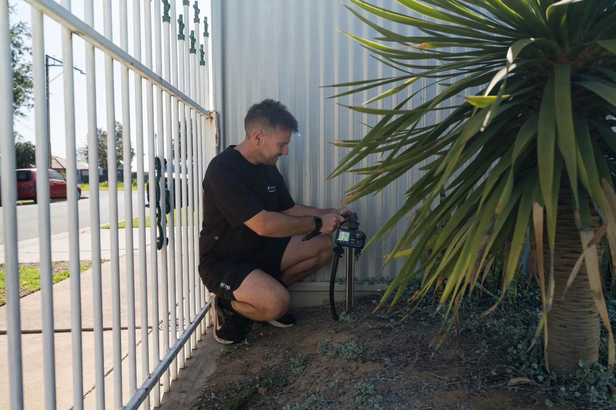 Simms plumber testing gas pressure at the meter