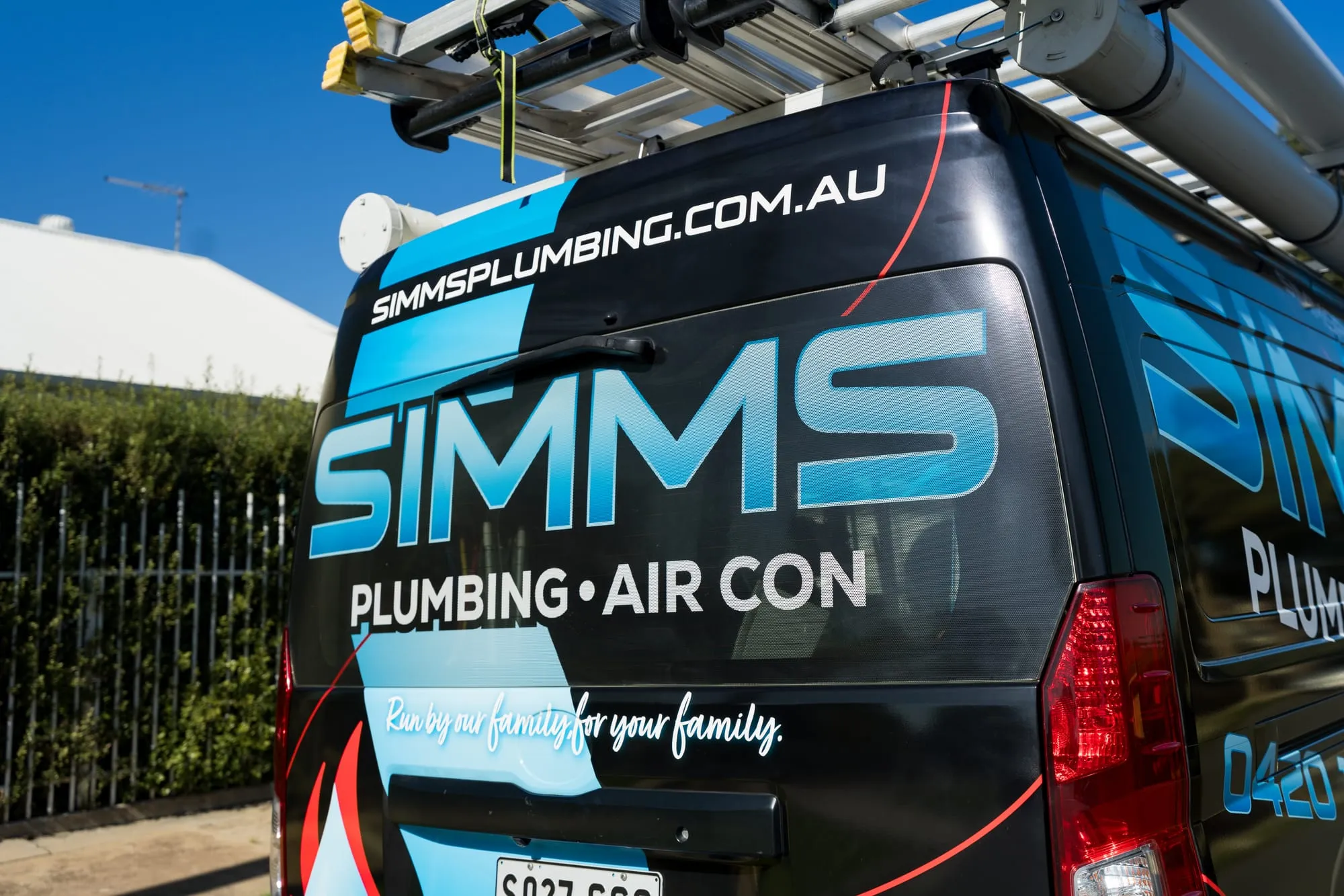 Rear of the Simms van showing the SIMMS Plumbing and Air Con logo