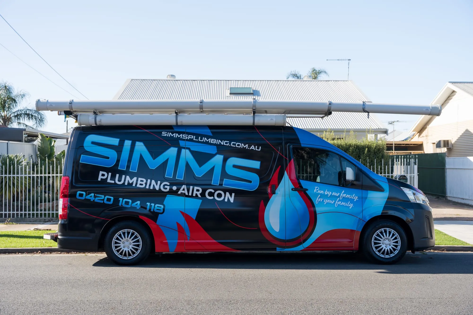 The Simms Plumbing & Air Conditioning van parked on a southern Adelaide street
